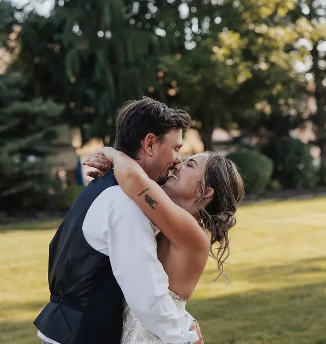 A couple kissing in a garden